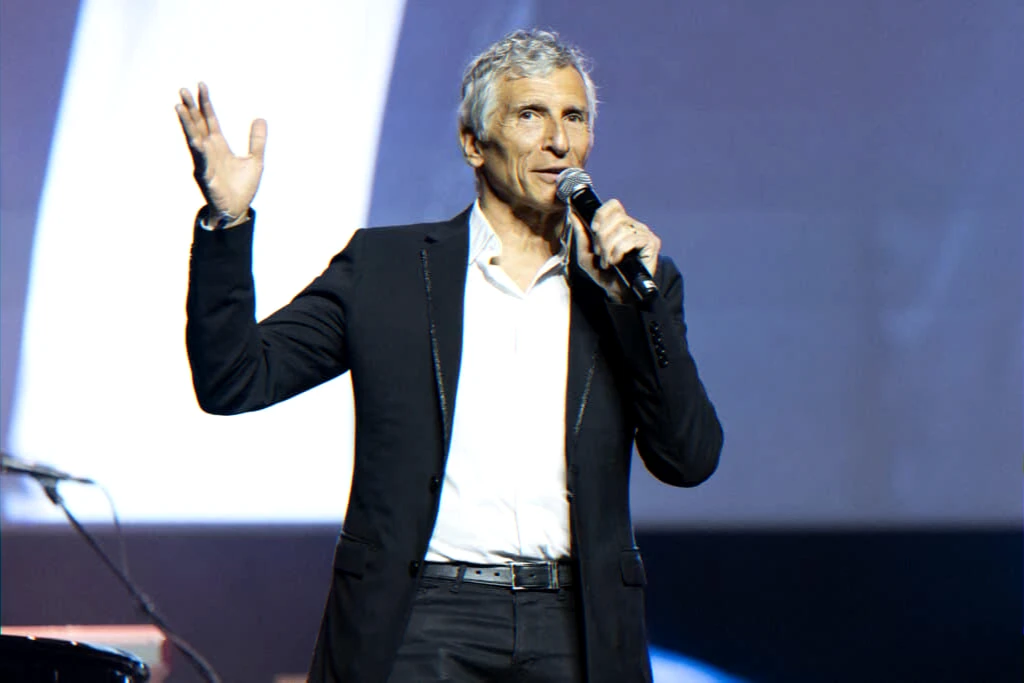 Television presenter expressing emotion and tribute after a colleague's death