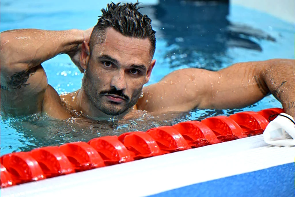 French Olympic sprint swimmer retirement and reconversion towards coaching, consulting and humanitarian work