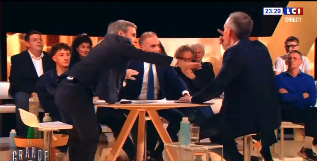 heated live TV debate with presenter intervening during prime-time political discussion