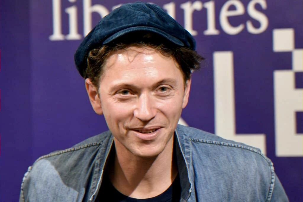 singer-songwriter 50th birthday profile — music and literary career