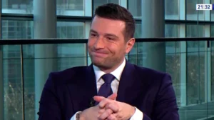 TV interview image for article on alleged private‑jet use and public denials