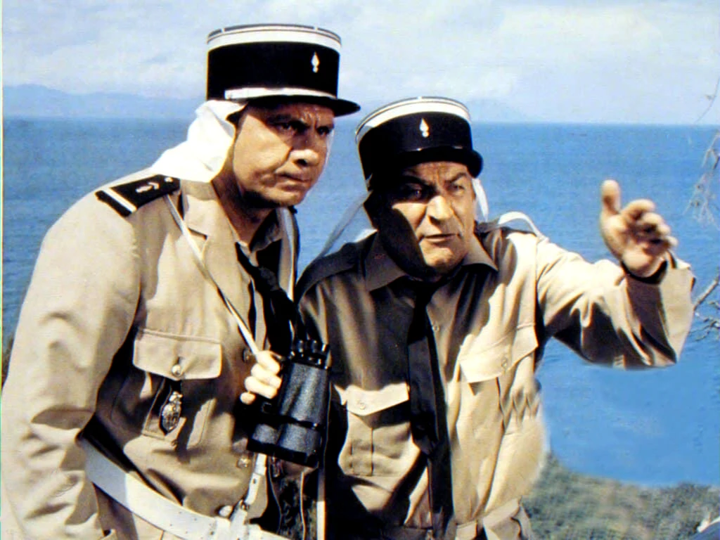 Vintage film still of two uniformed figures by the sea illustrating cinema legacy and uncanny anecdotes