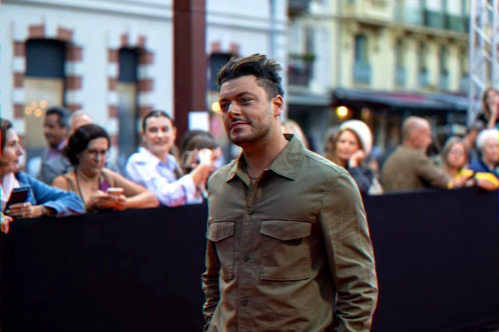Comedian at a red carpet event connected to an anniversary social post