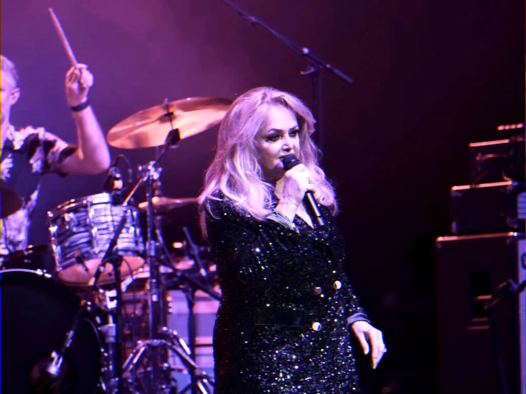 stage image for health update article about iconic 1980s singer